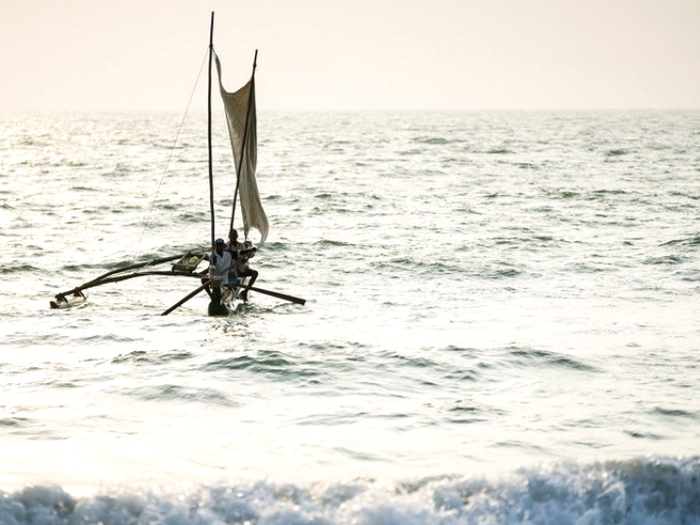 Fisherman in traditional boat (Oruwa)